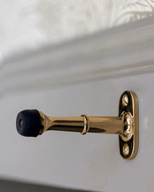 Dörrstopp mässing, väggmontage - Ovolin