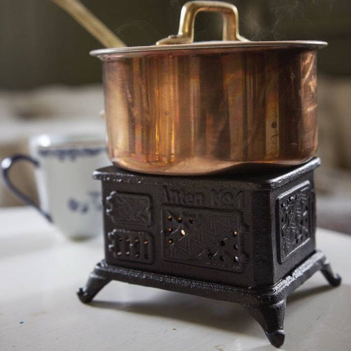 Liten Köksspis för Värmeljus fram med kastrull